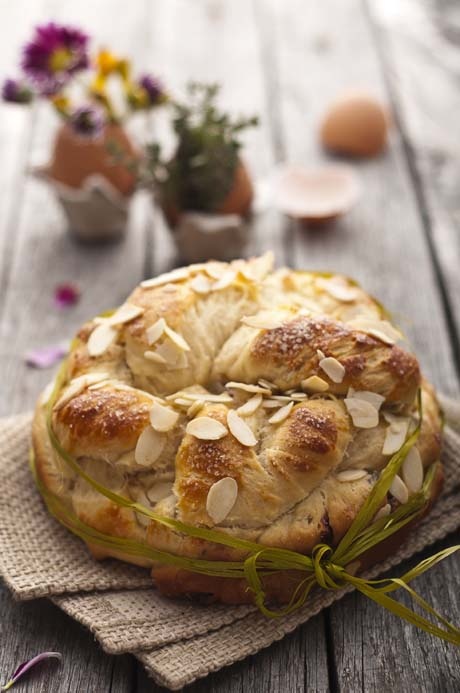 Sweet Easter bread with egg decoration and flowers